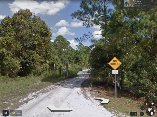 Dirt Trail Into Lot Area